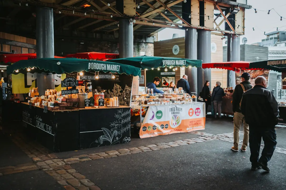 A covered food stall at a busy street market